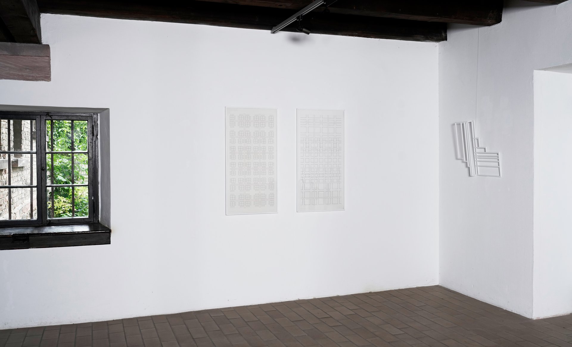 view of installation: max h. mahlmann, &quot;im zusammenhang getrennt a&quot; and &quot;im zusammenhang gefügt b,&quot; both 1983, indian ink on paper, 100 x 50 cm; &quot;einheiten im raum,&quot; (1987), lacquer, wood, 60 x 60 x 10 cm, edition hoffmann