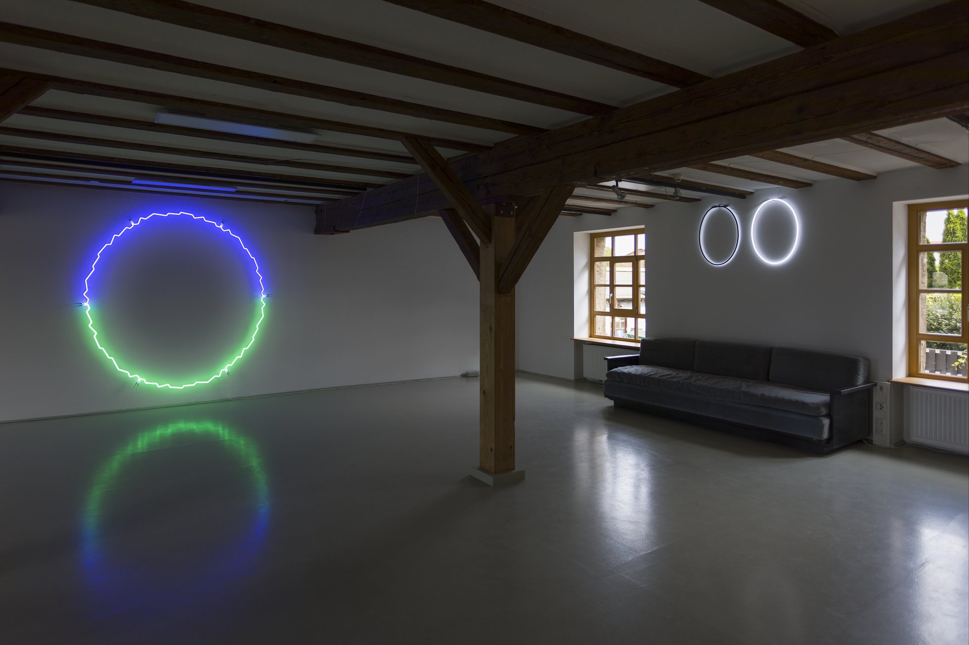 view of installation: &quot;edged circle&quot; (2020); &quot;oo dark light&quot; (1985)