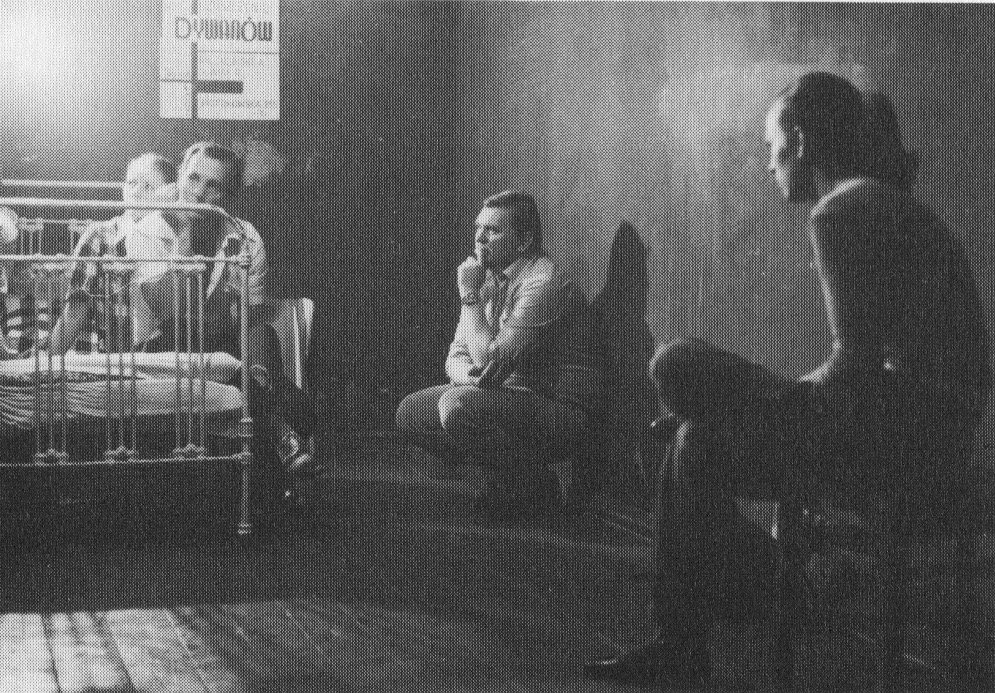 view from &quot;network as sowing&quot; an exhibition of &#x27;moral posters&#x27; by maria waśko in a private apartment with discussion in łódź, 1982. (center: ryszard waśko)